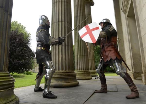 Re-enactors  Stewart Iverson and Dean Davidson battle it out at the International Medieval Congress, Leeds University. Picture Bruce Rollinson
