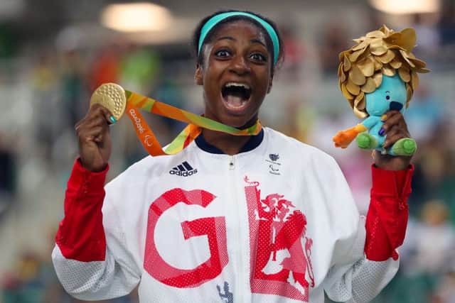 Kadeena Cox celebrates with her Gold medal won in the Women's C4-5 500m Time Trial final.