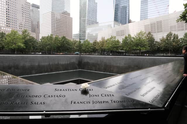 Flowers are placed on names at the September 11th Memorial at Ground Zero in lower Manhattan where the Twin Towers once stood