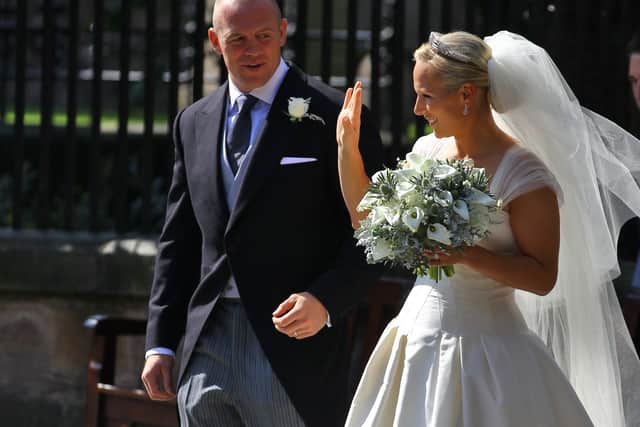 Mike Tindall and Zara Phillips after their Royal wedding at Canongate Kirk on July 30, 2011 in Edinburgh, Scotland. (Photo by Jeff J Mitchell/Getty Images)