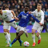 Leicester City midfielder Wilfred Ndidi vies with Leeds United’s Robin Koch and midfielder Adam Forshaw (Photo by GEOFF CADDICK/AFP via Getty Images)