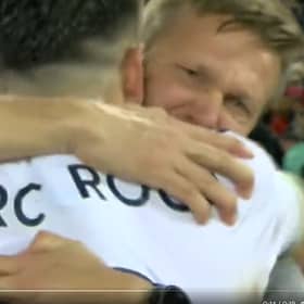 Jesse Marsch and Marc Roca embrace after Leeds United’s win at Liverpool.