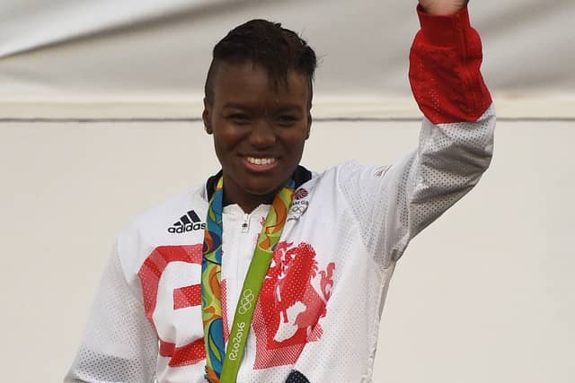 (FILES) In this file photo taken on October 17, 2016 Great Britain's Olympic boxer Nicola Adams is applauded by the general public on a stage in front of Manchester Town Hall after taking part in a "Heroes' Parade" through the streets of Manchester in north west England in acknowledgement of their achievements at the Rio 2016 Olympic and Paralymic Games in Brazil earlier this summer. - One of the most popular programmes on British television, "Strictly Come Dancing", is to feature the first same-sex pairing in its 16-year-history, the BBC said Wednesday.