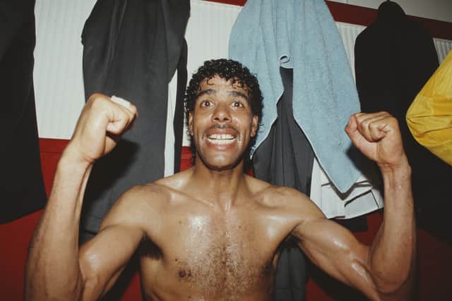 Leeds United player Chris Kamara celebrates in the dressing room after Leeds United had gained promotion to the 1st Division on May 5, 1990. (Photo Radders/ Allsport/Getty Images)