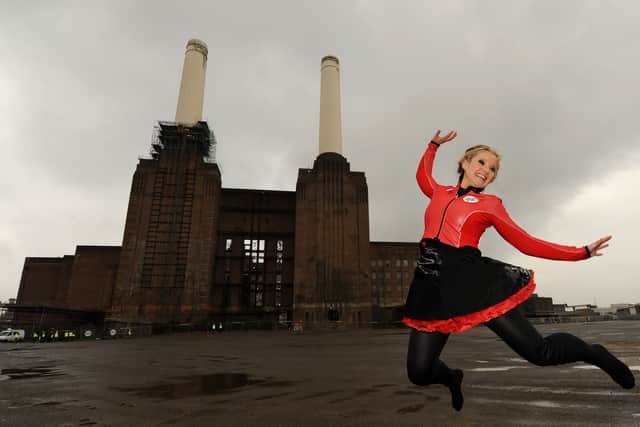 Helen Skelton poses for photographs after walking a high-wire between the chimneys of Battersea Power Station in south London, on February 28, 2011. The event was in aid of Red Nose Day. AFP PHOTO/BEN STANSALL (Photo credit should read BEN STANSALL/AFP via Getty Images)