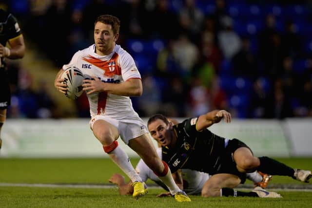 Richie Myler of England gets past Lance  Hohaia of the Exiles during the International Origin Match between England and Exiles at The Halliwell Jones Stadium on June 14, 2013 in Warrington, England.  (Photo by Gareth Copley/Getty Images)
