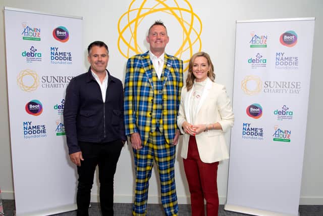 Kenny Logan, Doddie Weir of the 'My Name'5 Doddie Foundation' and Gabby Logan attend the Sunrise Charity Day on September 11, 2019 in London, England. (Photo by Eamonn M. McCormack/Getty Images for BGC Partners)