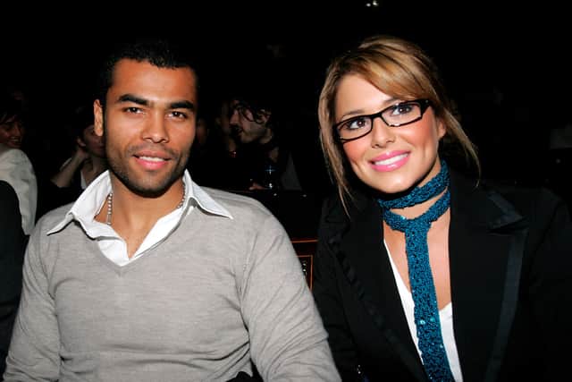 England football player Ashley Cole and singer Cheryl Tweedy of Girls Aloud attend the Julien Macdonald fashion show as part of London Fashion Week Autumn/Winter 2006/7 at the Freemason's Hall on February 14, 2006 in London. (Photo by Gareth Cattermole/Getty Images)