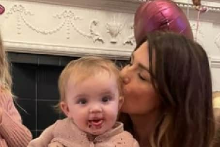 Elsie can be seen smiling after tucking into some cake. (Picture: Instagram/@helenskelton)