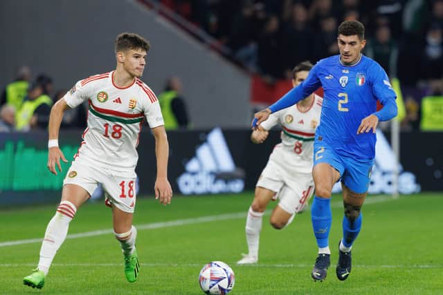 Milos Kerkez of Hungary competes for the ball with Giovanni Di Lorenzo of Italy (Photo by Laszlo Szirtesi/Getty Images)