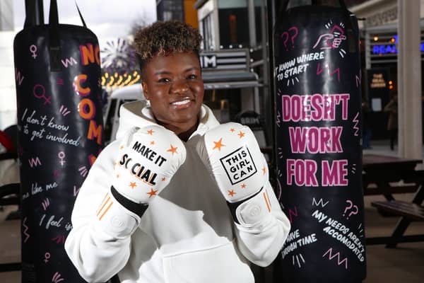 Nicola Adams poses with a punch bag representing a key barrier that prevents women from getting active as part of the launch a ‘This Girl Can’ campaign. (Credit Rachel Adams/PA Wire)