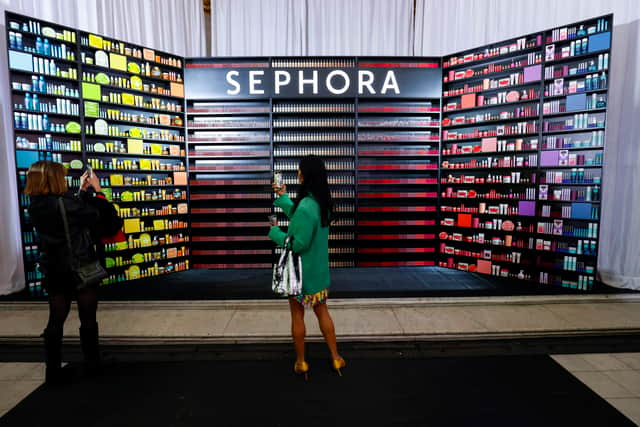 A general view of guests taking photos on their phones during the Sephora UK launch event