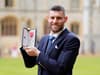 Leeds United export and Elland Road favourite receives MBE at Windsor Castle after decorated 800-plus game career