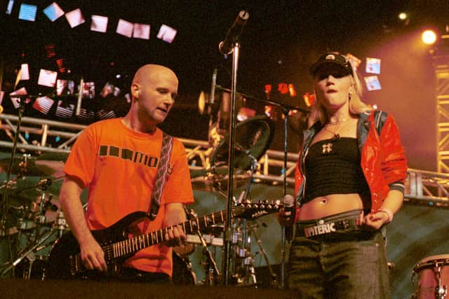 DJ/musician Moby performs with singer Gwen Stefani of No Doubt December 17, 2000 at K-ROQ''s Almost Acoustic Christmas concert in Los Angeles, CA. (Photo by Gary Livingston/Newsmakers)