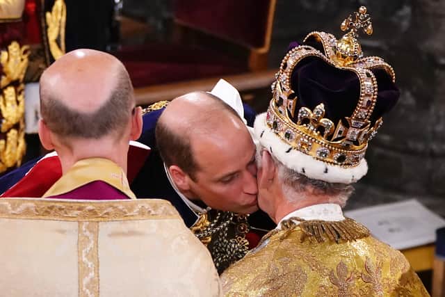 Prince William kisses his father, Britain’s King Charles III as he pays homage (Photo: Getty Images)