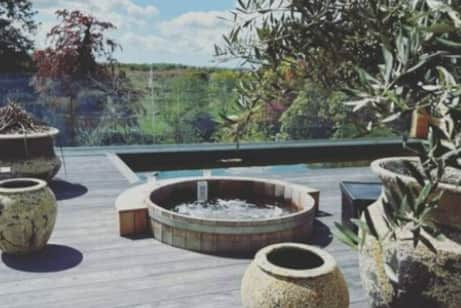 The hotel has steamy hot tubs with stunning views. (Picture: Instagram/@helenskelton) 