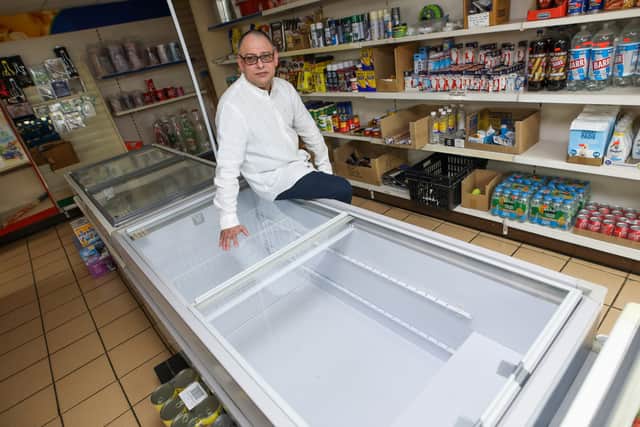 Ruhail Shahazad who owns Tremorfa Superstore in Cardiff has had to turn off 10 of his fridge and freezers in his shop, along with some of the lights, after his energy bills soared from £800 a month to £4,700.