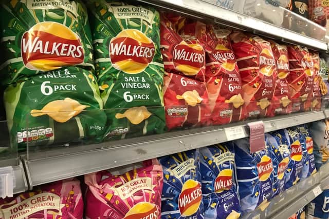 Crisp packets in the supermarket (Shutterstock)