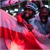 England fans cheer as they watch a live broadcast of the semi-final match between England and Denmark  (Getty Images)
