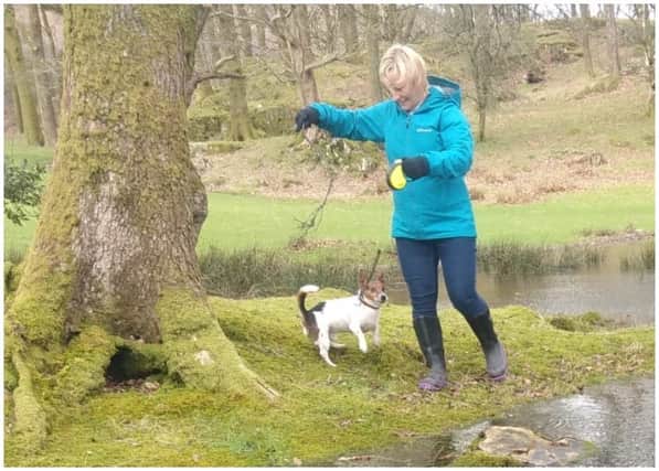 Murdered PCSO Julia James walking her Jack Russell Toby and wearing a light blue waterproof coat, blue jeans and dark coloured Wellington style brown boots - the same clothes she had on when last seen before her murder (Kent Police)