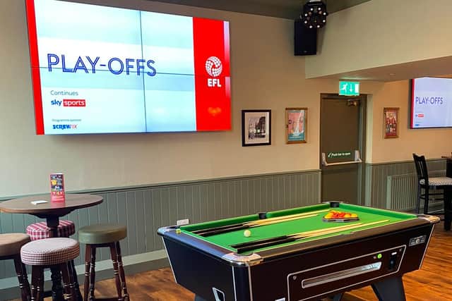The media wall features a large four-in-one screen for the ultimate sports watching experience.