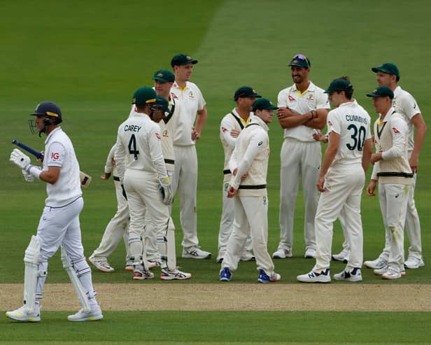 England's Stuart Broad (L) walks back to the pavilion after losing his wicket for 12 runs on day three of the second Ashes cricket Test match between England and Australia at Lord's cricket ground in London on June 30, 2023. (Photo by Ian Kington / AFP) / RESTRICTED TO EDITORIAL USE. NO ASSOCIATION WITH DIRECT COMPETITOR OF SPONSOR, PARTNER, OR SUPPLIER OF THE ECB (Photo by IAN KINGTON/AFP via Getty Images)