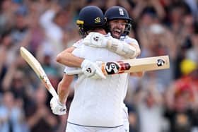 Chris Woakes of England celebrates with teammate Mark Wood after hitting the winning runs to win the LV= Insurance Ashes 3rd Test Match between England and Australia at Headingley on July 09, 2023 in Leeds, England. (Photo by Stu Forster/Getty Images)