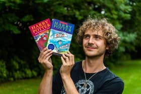 Max Roe with first edition copies of Harry Potter books his mum got him when he was young, one signed by JK Rowling could be worth 10K. 