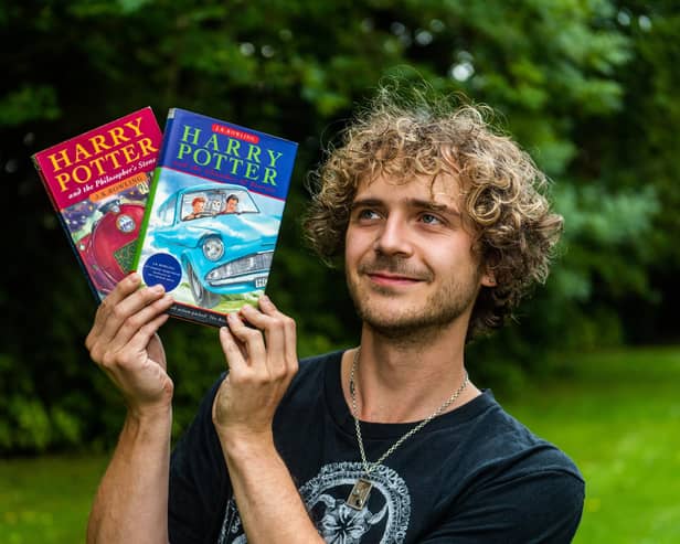 Max Roe with first edition copies of Harry Potter books his mum got him when he was young, one signed by JK Rowling could be worth 10K. 