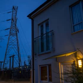 Insulators on an electricity sub station are seen near homes in Manchester.
