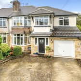 This extended family home in Moortown has a large driveway and garage to the front.