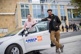 Chris Neary from Amber Cars and Dhruv Dev, Student Union President, outside Leeds Beckett University, Leeds, UK. Picture by Anthony Devlin