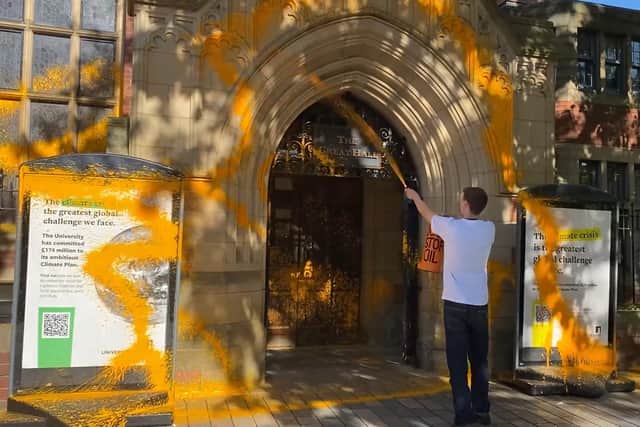 A Just Stop Oil supporter sprayed orange paint on a University of Leeds building on Thursday before being arrested by police. Picture by Just Stop Oil