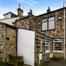 This four bedroom stone cottage is on the market.
