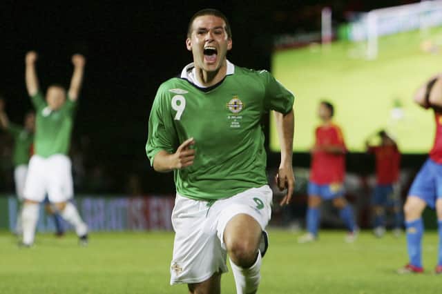 David Healy of Northern Ireland celebrates his third goal during the Euro 2008 Qualifying Group F Match between Northern Ireland and Spain at Windsor Park on September 6, 2006 in Belfast, Northern Ireland.  (Photo by Laurence Griffiths/Getty Images)