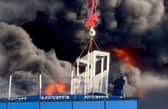 A workman was lifted to safety after a huge fire at a high-rise building in Reading. (Credit: Chris Lauder/X/PA Wire