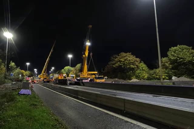Captivating footage has been shared showing the grand entrance of one of two new super-span gantries being lifted into place above the M621 in Leeds. Picture by National Highways