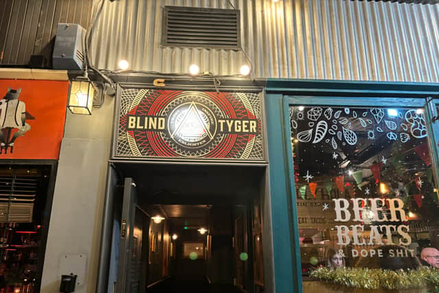 The entrance to Blind Tyger is hidden between the Watermark Bar and Sandinista.