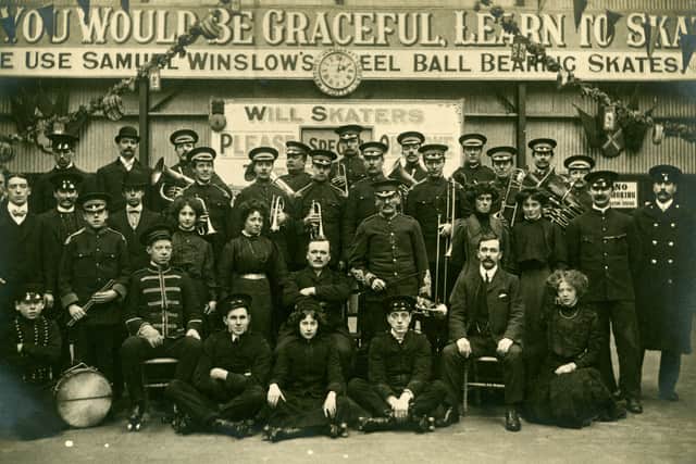 Postcard showing a group of people, including a military band and roller skaters, at the American Roller Skating Rink in Headingley.  Circa 1908 to 1910.