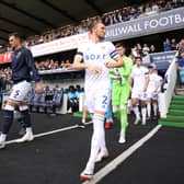 Luke Ayling of Leeds United (R) leads the team out prior to the Sky Bet Championship match between Millwall and Leeds United at The Den on September 17, 2023 in London, England. (Photo by Alex Pantling/Getty Images)