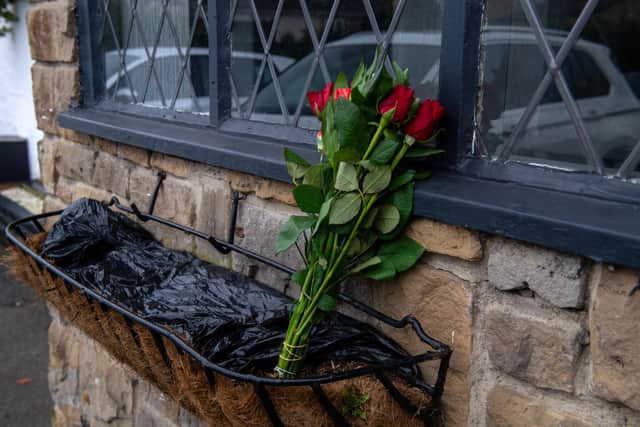 A bunch of roses left at the Three Horse Shoes pub in Oulton (Photo by Bruce Rollinson/National World)