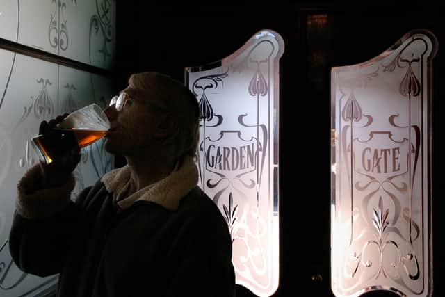John Ellis enjoys a pint of beer at The Garden Gate in February 2005.
