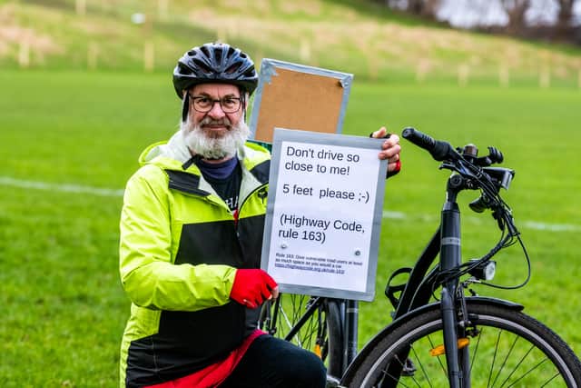 Tim's sign came as part of the 'More Than a Cyclist' campaign, that aims to remind drivers that cyclists are people too. Photo: James Hardisty.