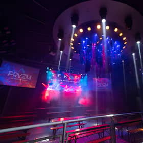 Lights flood the dancefloor
