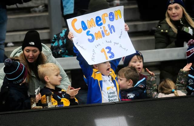 A young fan shows his support.