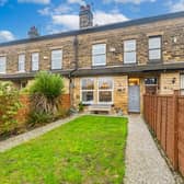 This gorgeous terraced home with gardens to the front and rear is on the market.