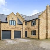 This impressive five bedroom home is for sale.