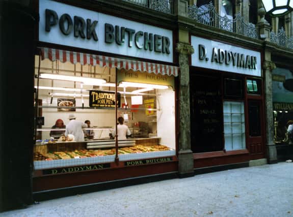 The shop window of pork butcher Dearlove Addyman  on Queen Victoria Street pictured in October 1989. The walkway was between Queen Victoria Street, left and the County Arcade. On the right is Goldsmith at number 23 County Arcade. These shops were about to be restored to their former glory as part of the scheme for the Victoria Quarter.