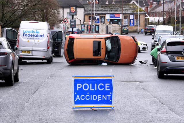 An overturned car on Lower Wortley Road blocked traffic. Photo: Simon Hulme.