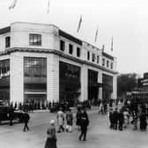 The Headrow at the junction with New Briggate, showing Lewis's department store on the left, possibly at the time of its opening on September 17, 1932 as the streets are lined with people and flags decorate the top of the store. On the right is the Paramount Cinema, later The Odeon, with films starring Claudette Colbert and Miriam Hopkins the main attraction.